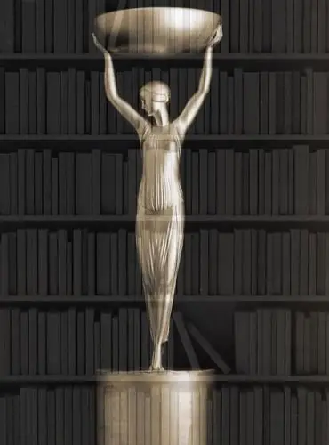 Man Booker Ödülü Kazanan Kitaplar Man Booker Ödülü kazanan kitaplar ve ödül heykelciği.